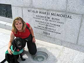 Cynthia and Marikay sitting in front of WW2 Memorial plaque