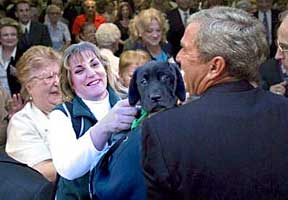 Photo edited for humor: President Bush holding Cynthia while Marikay looks on